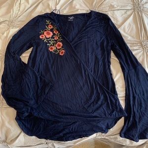 Boutique navy cross front top with floral detail